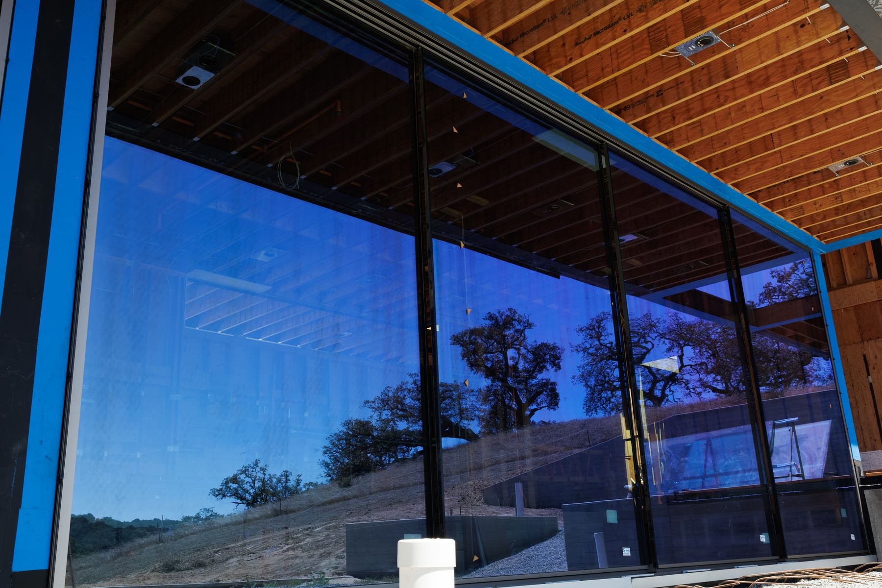 Close view of installed scenic door glazing and reflections