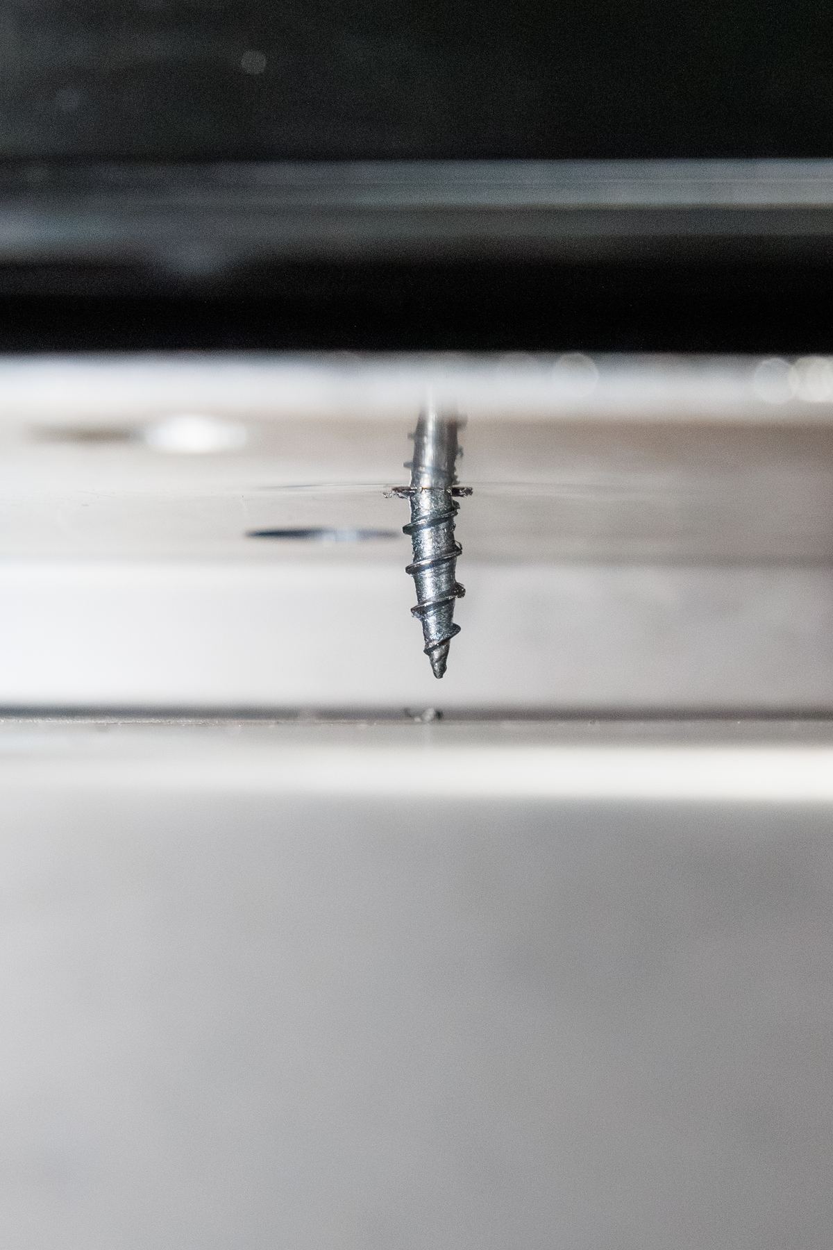 Close-up of the fastener that secures the bottom track to the J&S sub sill