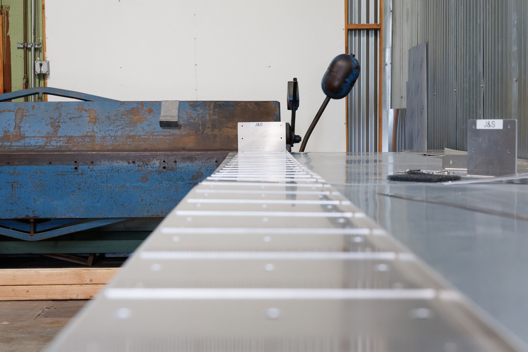 J&S aluminum sub sill sections arranged on the fabrication bench